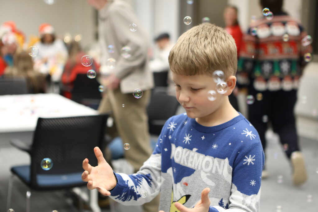 Child playing with bubbles