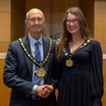 Chairman Les Burrows and Vice-Chairman Louise Mead shaking hands